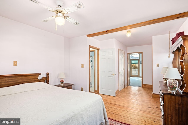 bedroom with ceiling fan and light hardwood / wood-style floors