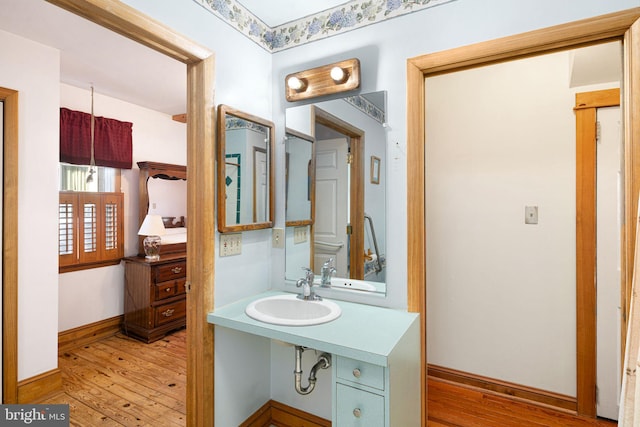 bathroom featuring hardwood / wood-style flooring and sink