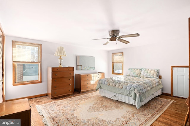 bedroom with ceiling fan and hardwood / wood-style floors