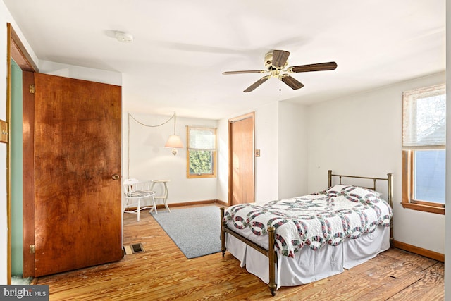 bedroom featuring ceiling fan and hardwood / wood-style floors