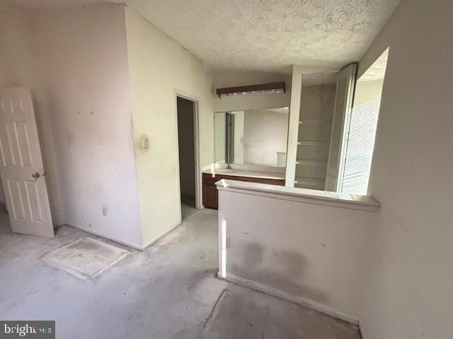 spare room with a textured ceiling