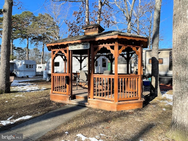 snow covered deck with a gazebo