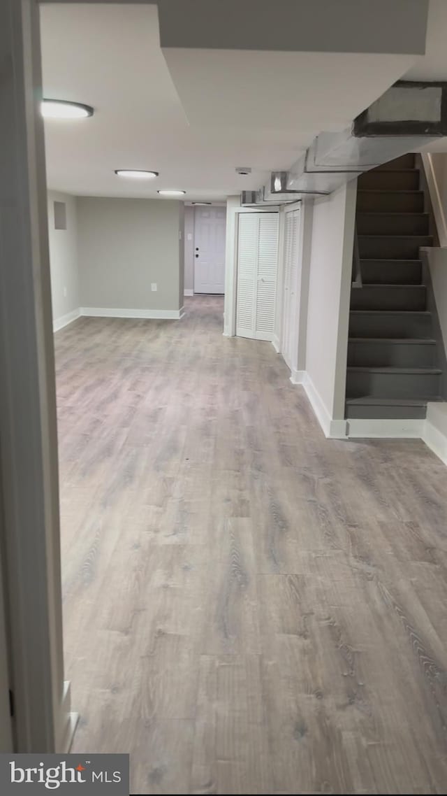 unfurnished living room featuring hardwood / wood-style flooring