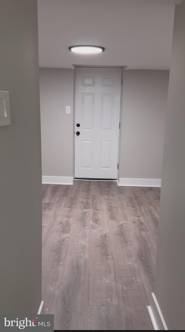 foyer with light wood-type flooring