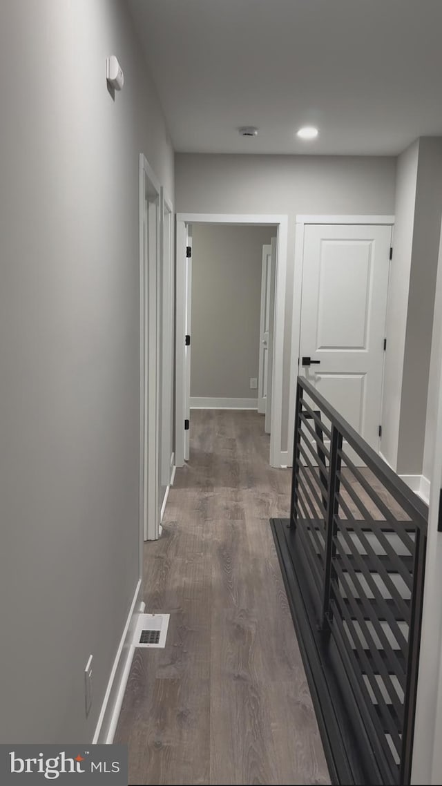 hall with dark hardwood / wood-style flooring