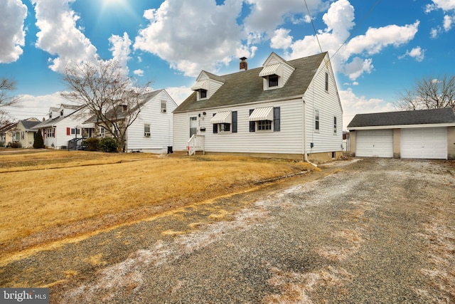 cape cod home with a front lawn, an outdoor structure, and a garage