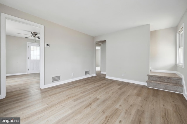 unfurnished living room with ceiling fan and light hardwood / wood-style flooring