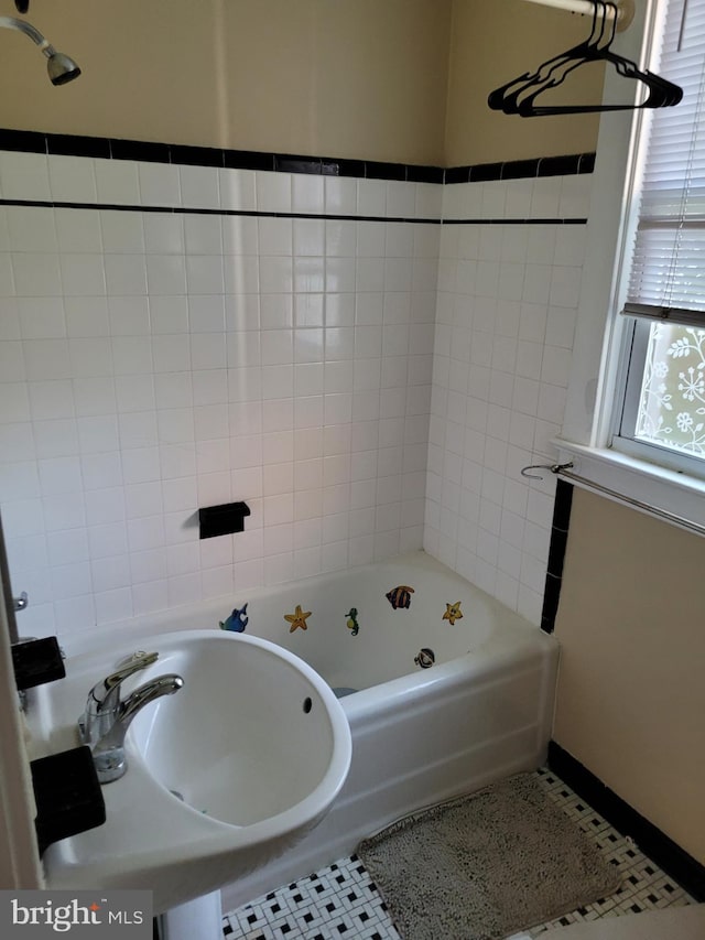 bathroom with shower / bath combination and tile patterned flooring