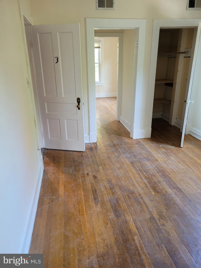 interior space with a closet and wood-type flooring