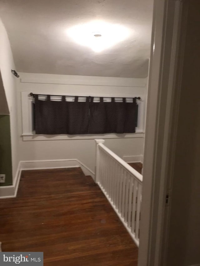 hallway featuring dark wood-type flooring