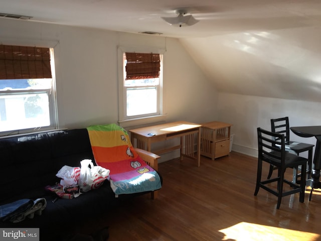 office area with hardwood / wood-style flooring, lofted ceiling, and plenty of natural light