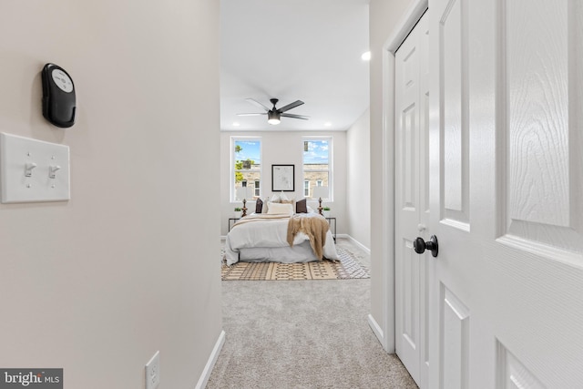 carpeted bedroom with ceiling fan