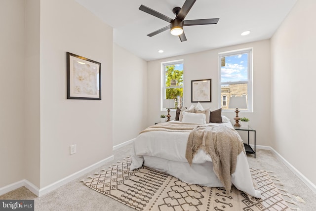 carpeted bedroom with ceiling fan