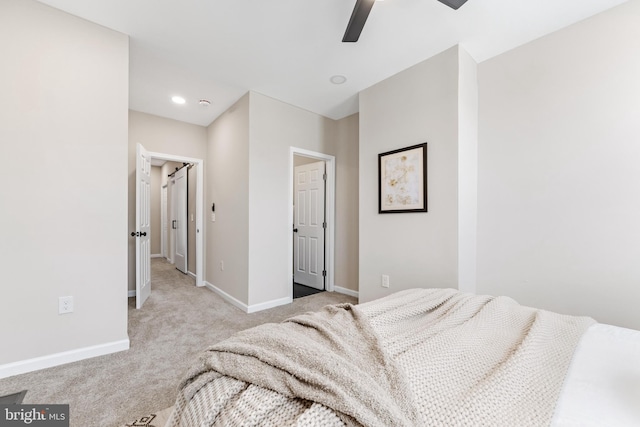 bedroom featuring ceiling fan and light colored carpet