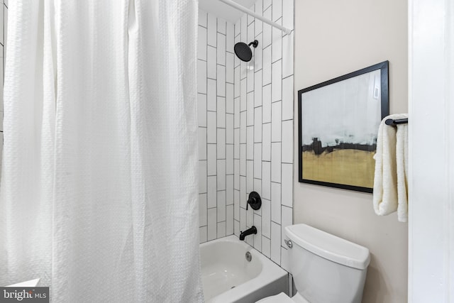 bathroom with toilet and shower / bath combo