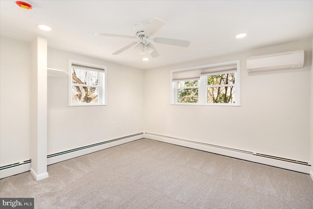 interior space featuring a healthy amount of sunlight, recessed lighting, and a wall mounted AC