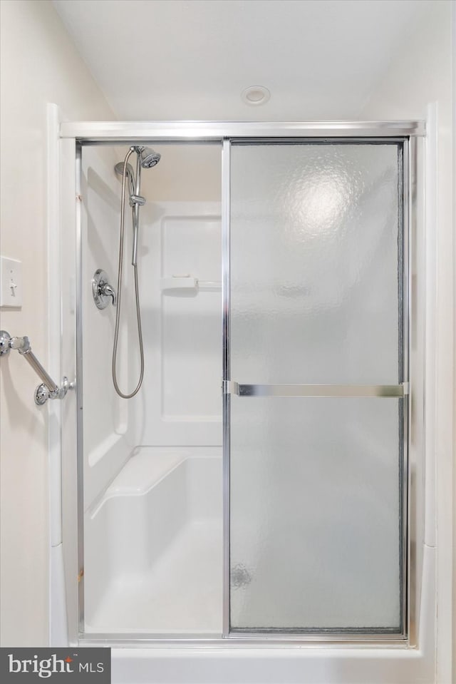 full bathroom with a stall shower