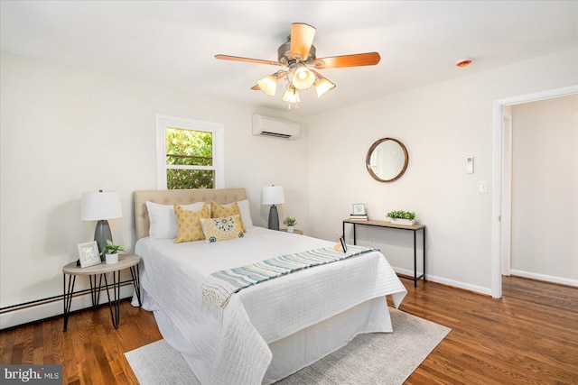 bedroom with a wall unit AC, baseboards, a baseboard heating unit, and wood finished floors