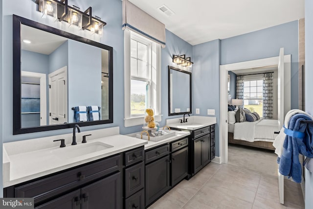 bathroom with vanity and tile patterned floors