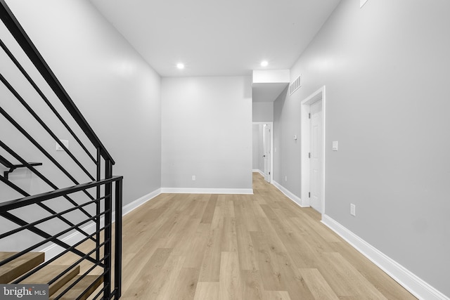 corridor with light wood-type flooring