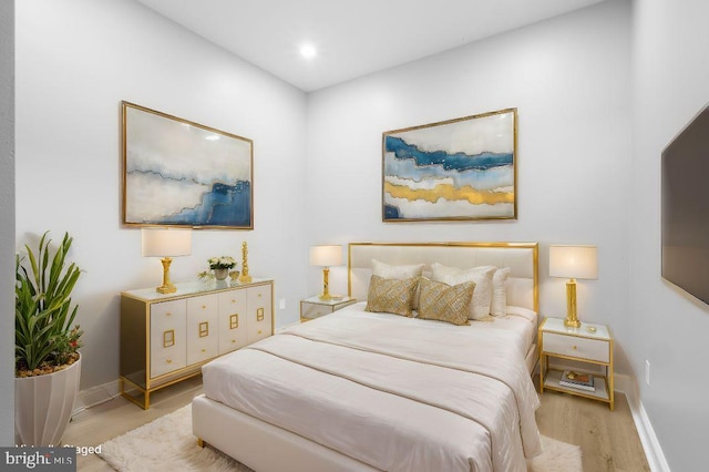 bedroom with light wood-type flooring