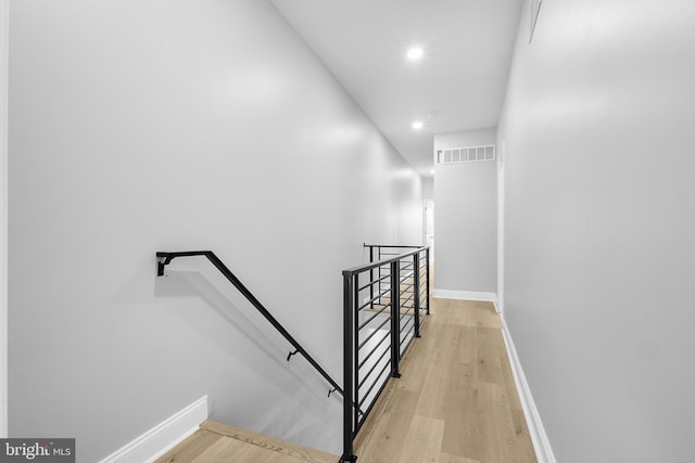 stairway featuring hardwood / wood-style flooring