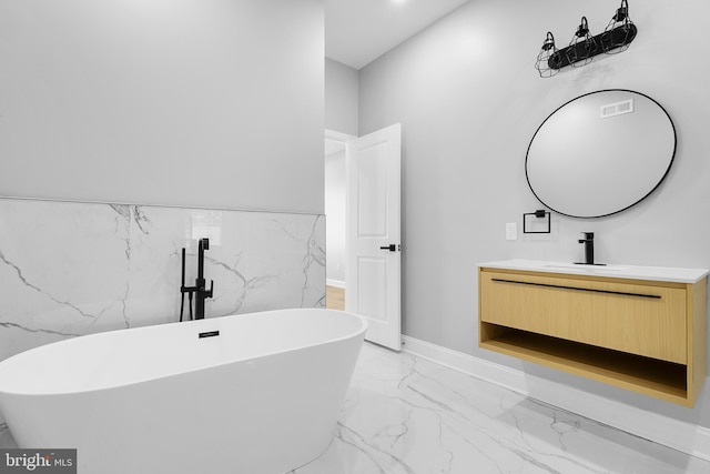 bathroom featuring vanity and a bathing tub