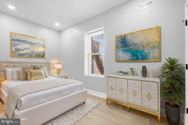 bedroom featuring light hardwood / wood-style flooring