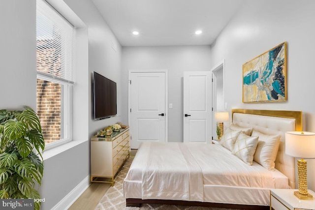 bedroom with light hardwood / wood-style floors