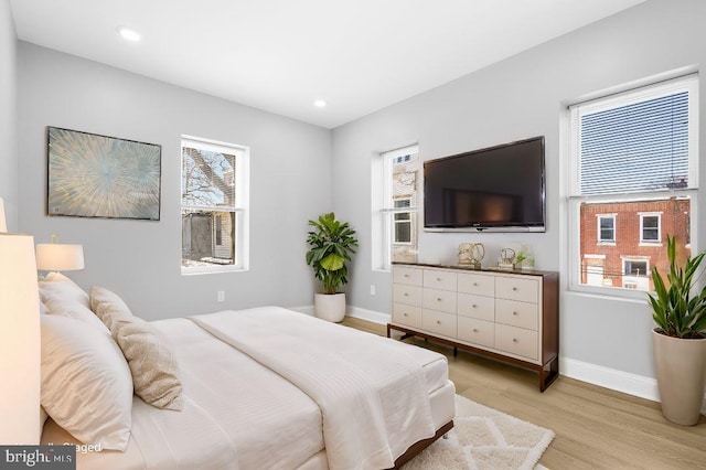 bedroom with light hardwood / wood-style floors