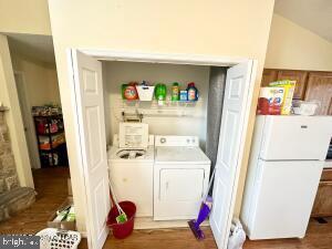 laundry room with washing machine and clothes dryer