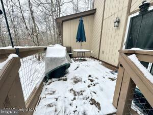 view of snow covered deck