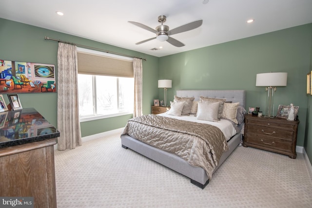 bedroom featuring light colored carpet and ceiling fan