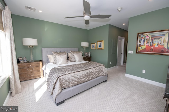 bedroom with light colored carpet and ceiling fan