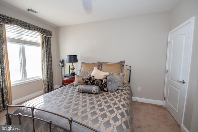 bedroom with light carpet and ceiling fan