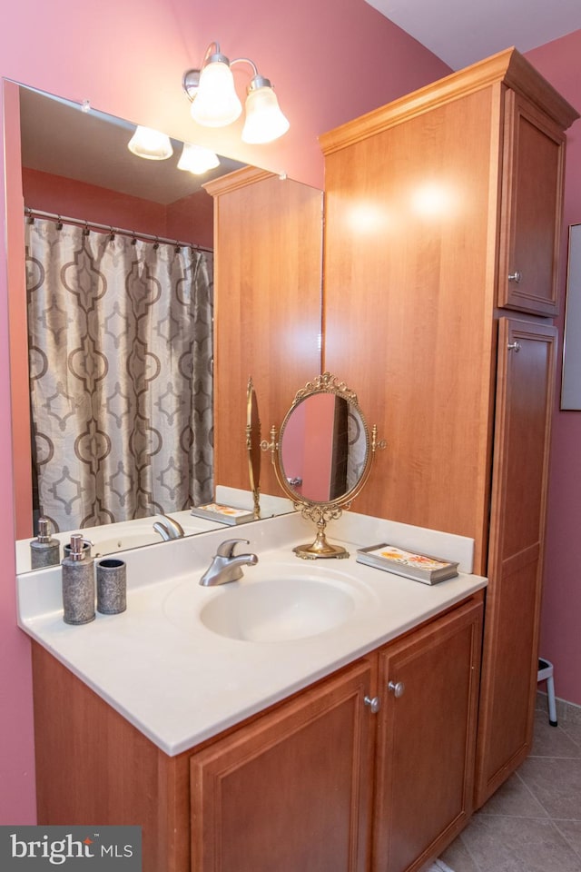 bathroom featuring tile patterned floors and vanity