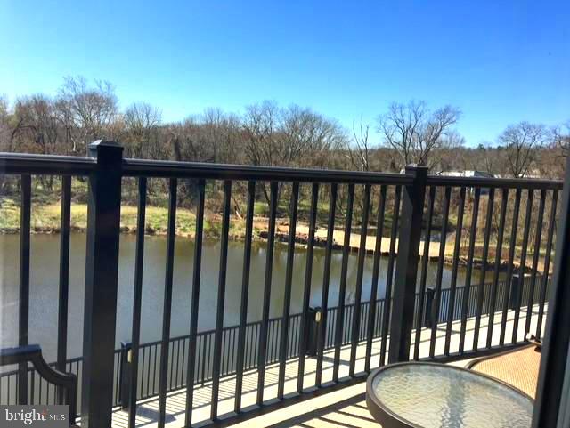 view of gate with a water view