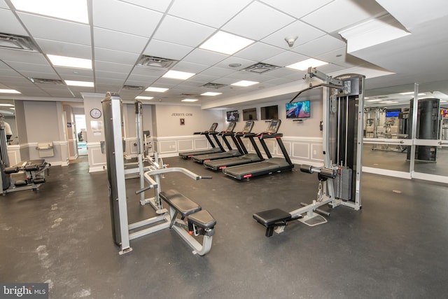 workout area featuring a drop ceiling