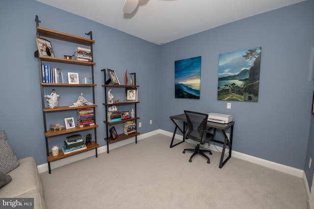 office space with light colored carpet and ceiling fan