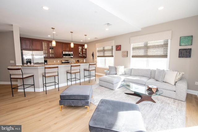 living room with light hardwood / wood-style flooring