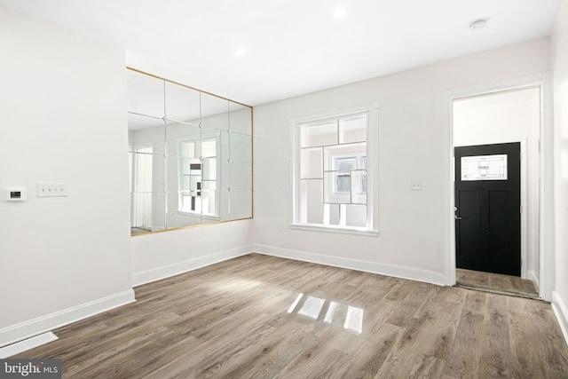 entrance foyer with hardwood / wood-style floors