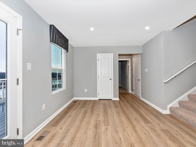 unfurnished room featuring light wood-type flooring