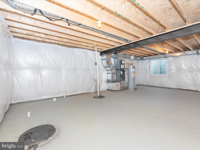 basement with water heater and heating unit