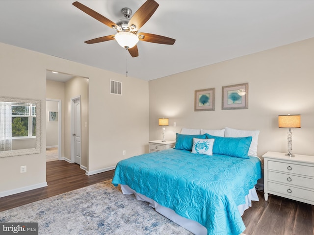 bedroom featuring dark wood-type flooring and ceiling fan