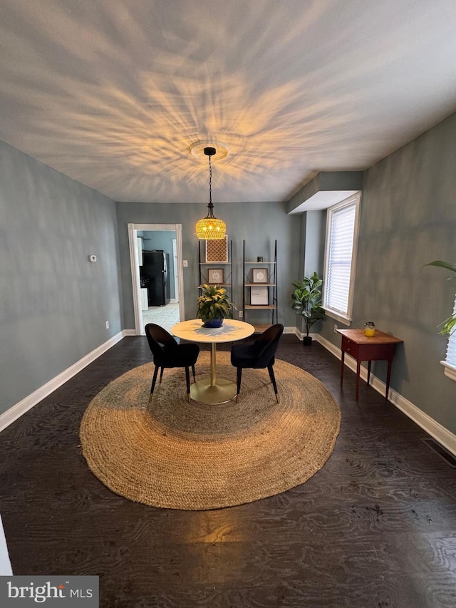 dining room featuring dark hardwood / wood-style flooring