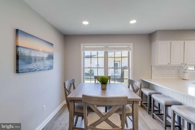 dining area with light hardwood / wood-style flooring