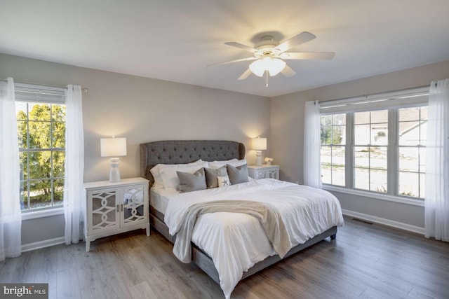 bedroom featuring ceiling fan and hardwood / wood-style flooring