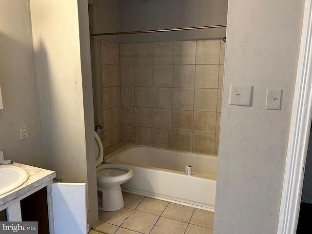 full bathroom with vanity, toilet, tile patterned floors, and tiled shower / bath combo