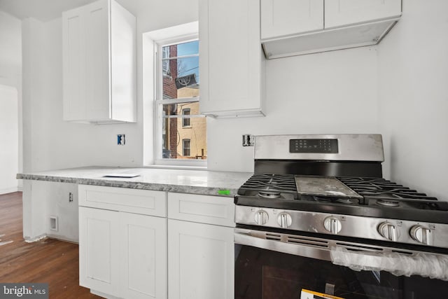 kitchen with gas range, dark hardwood / wood-style floors, and white cabinets