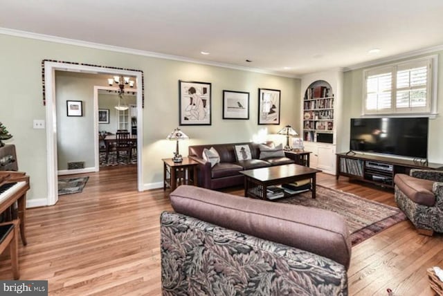 living room with baseboards, wood finished floors, and crown molding